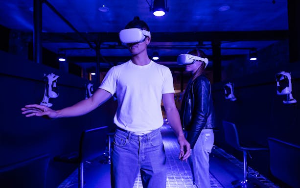 Visitors experiencing Van Gogh The Immersive Experience with VR headsets.