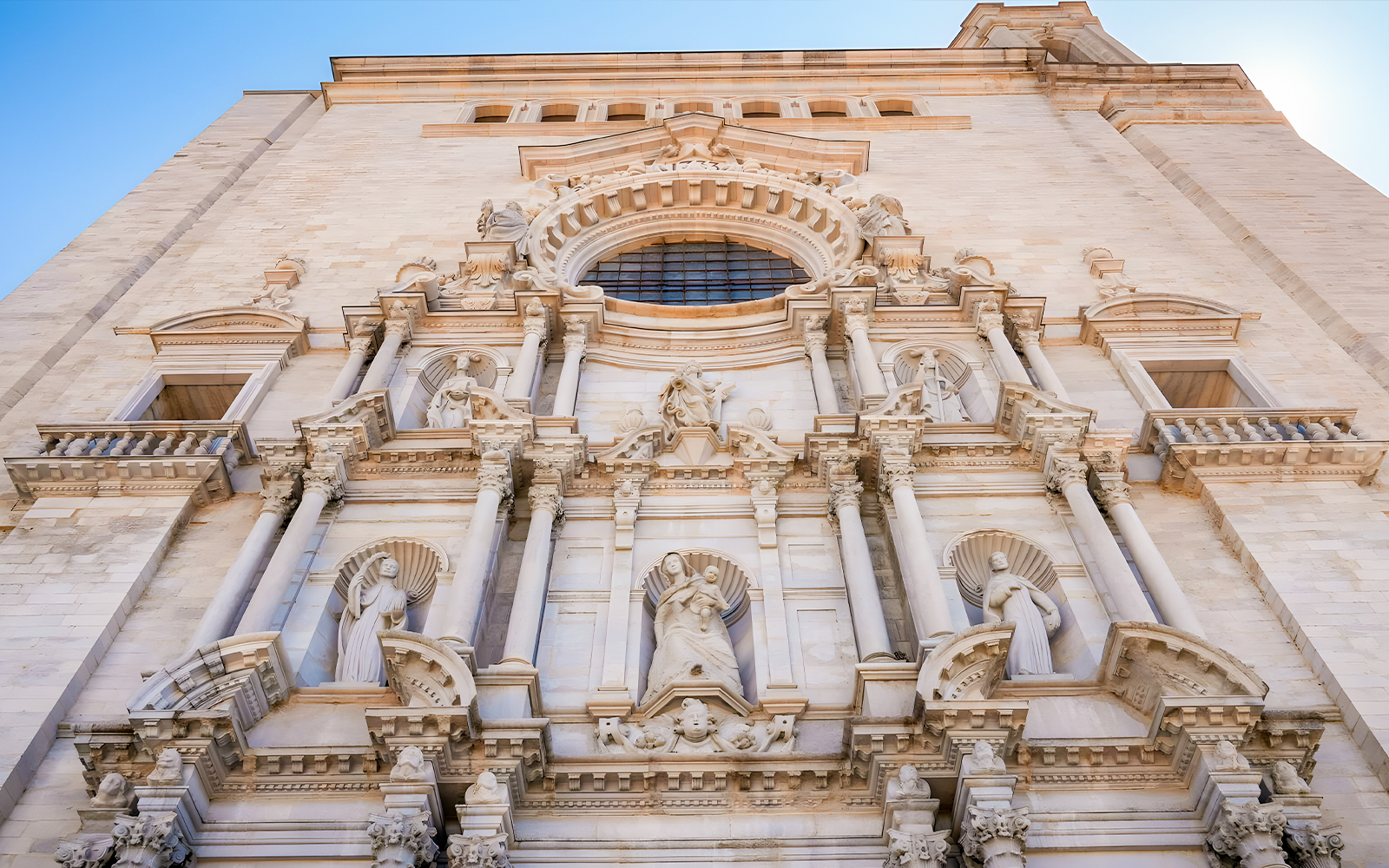 Facade of Girona Cathedral with detailed sculptures, Girona, Catalonia, Spain.