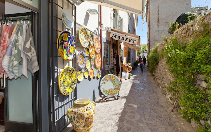 Ceramic shop and narrow street in Positano during guided tour from Sorrento.
