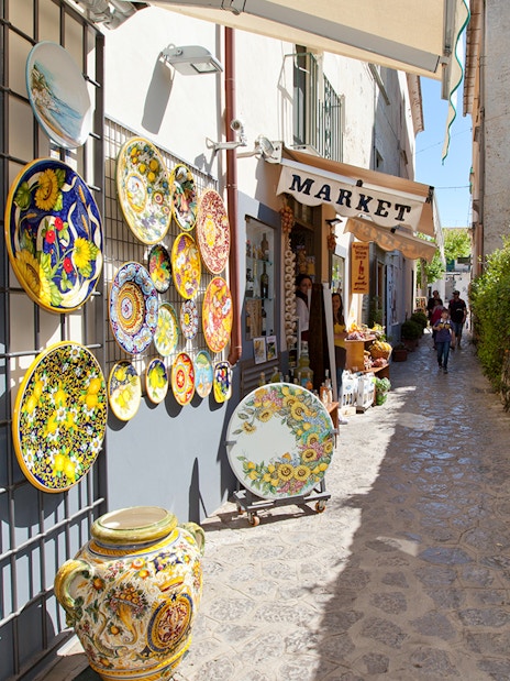Ceramic shop and narrow street in Positano during guided tour from Sorrento.