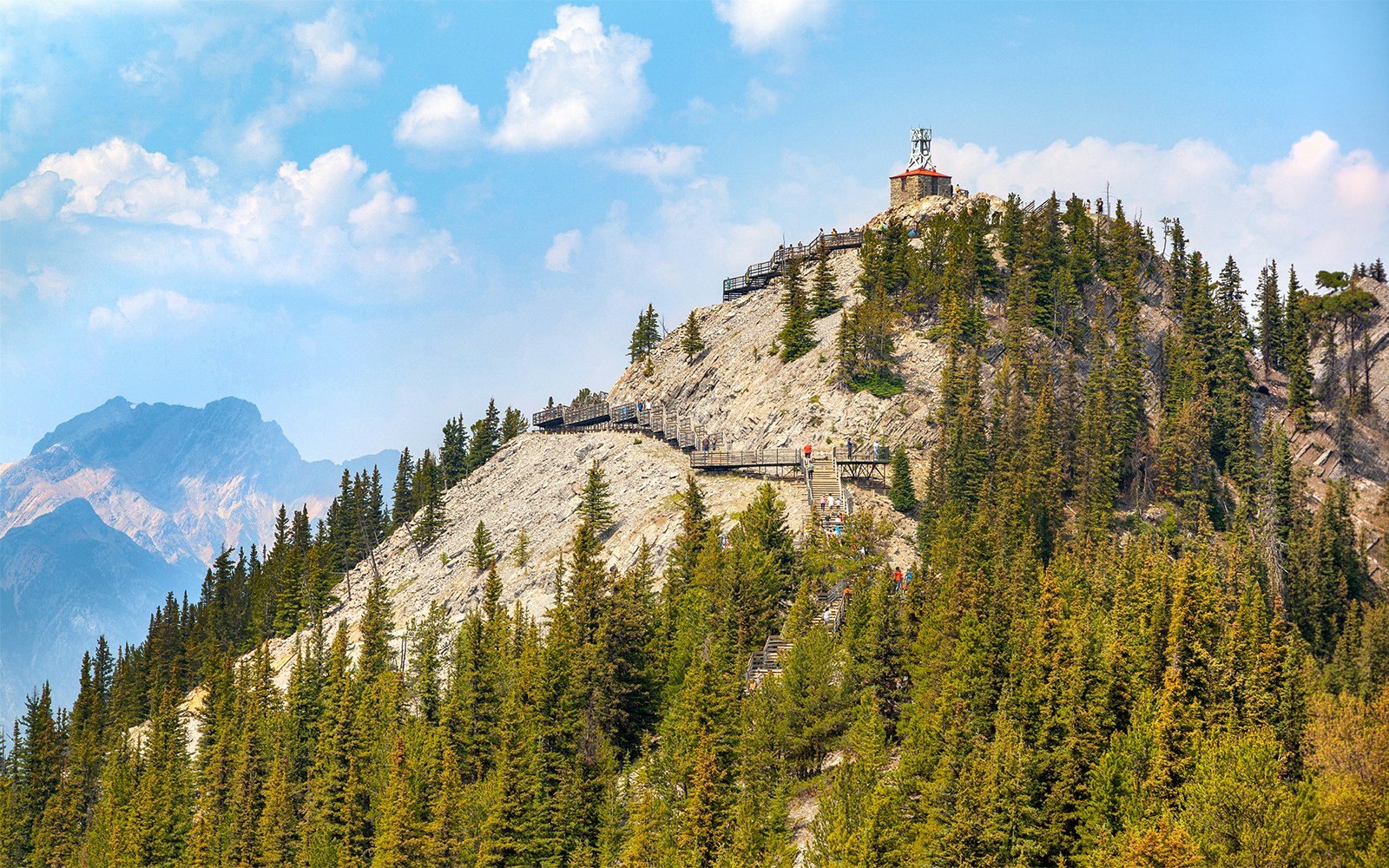 Cosmic Ray Station on Sanson's Peak, Banff National Park, with surrounding forest and mountain views.