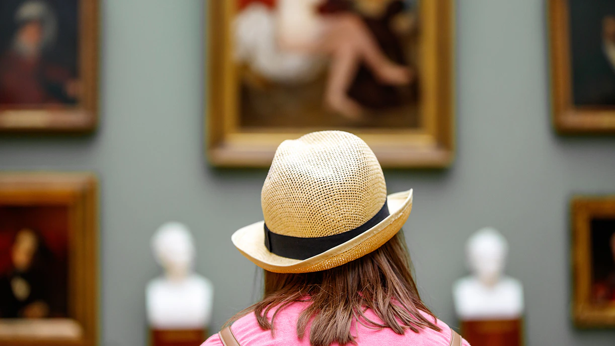 Visitor viewing art at Recoletos Room, Mapfre Foundation, Madrid.