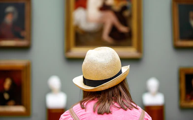 Visitor viewing art at Recoletos Room, Mapfre Foundation, Madrid.