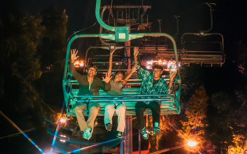 Friends enjoying the Skyride at night in Singapore.