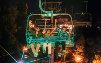 Friends enjoying the Skyride at night in Singapore.