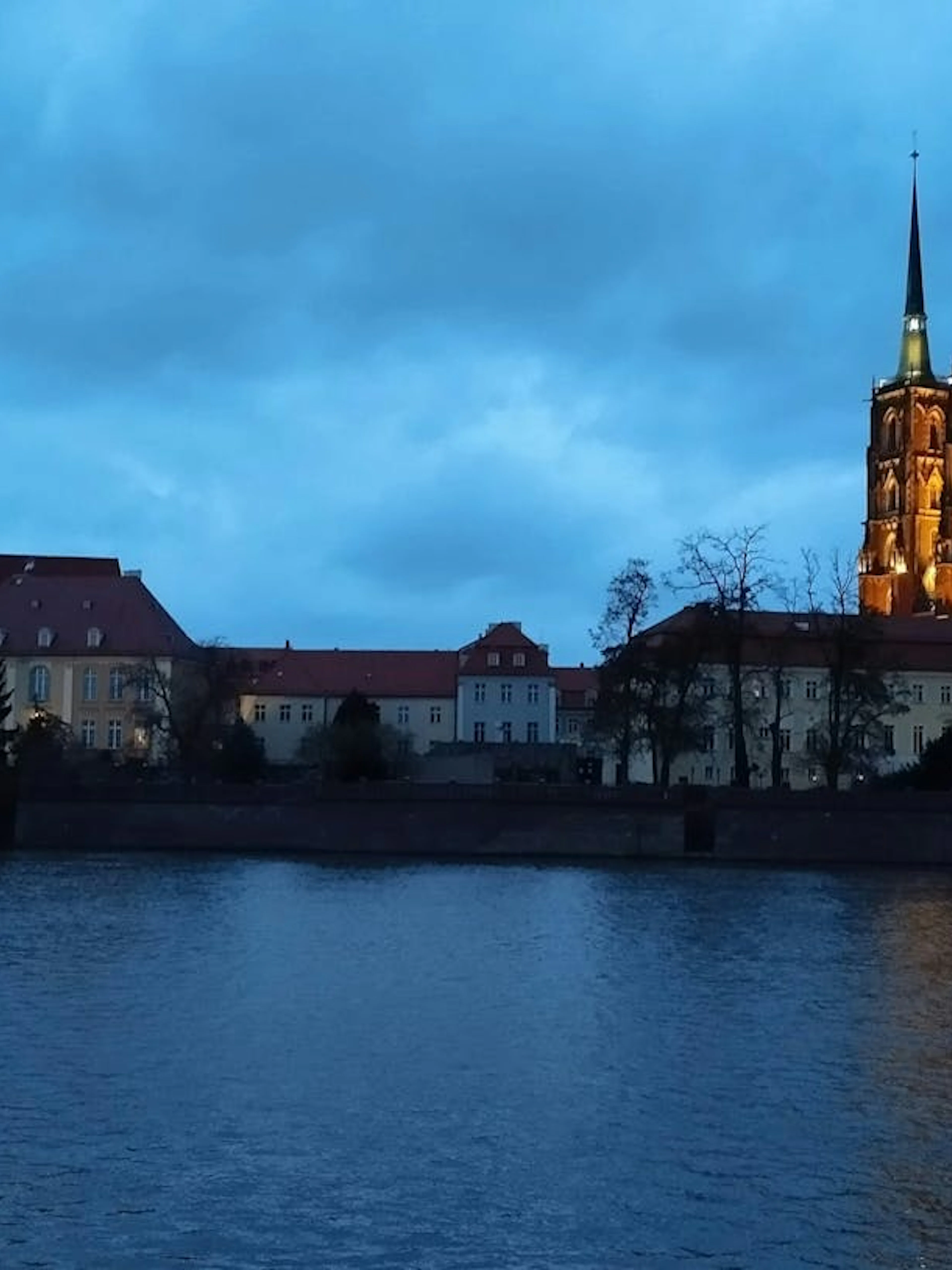 Wroclaw Cathedral and skyline at dusk during self-guided city exploration game.