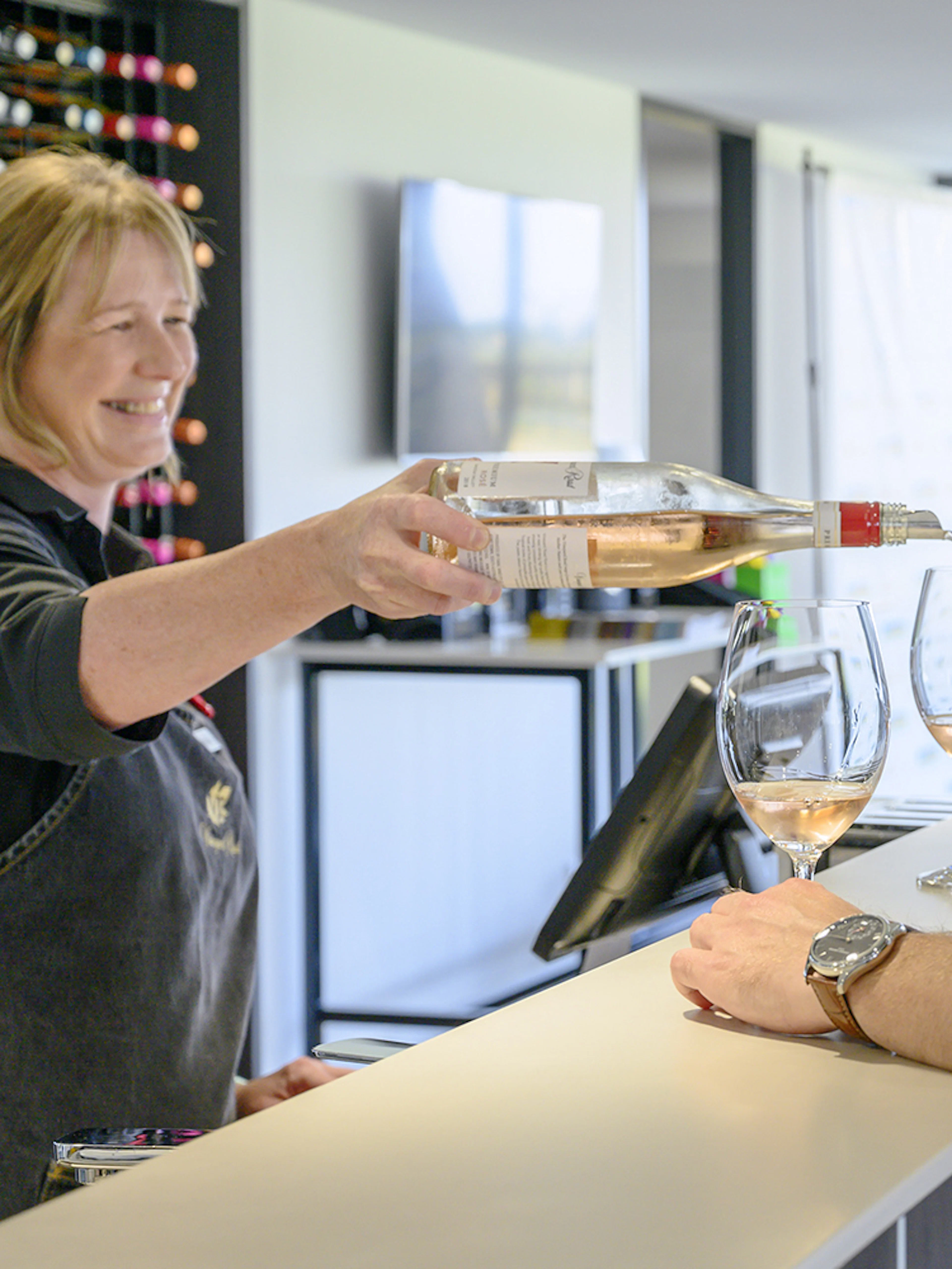 Wine tasting at a Barossa Valley winery with a group enjoying a pour of rosé.