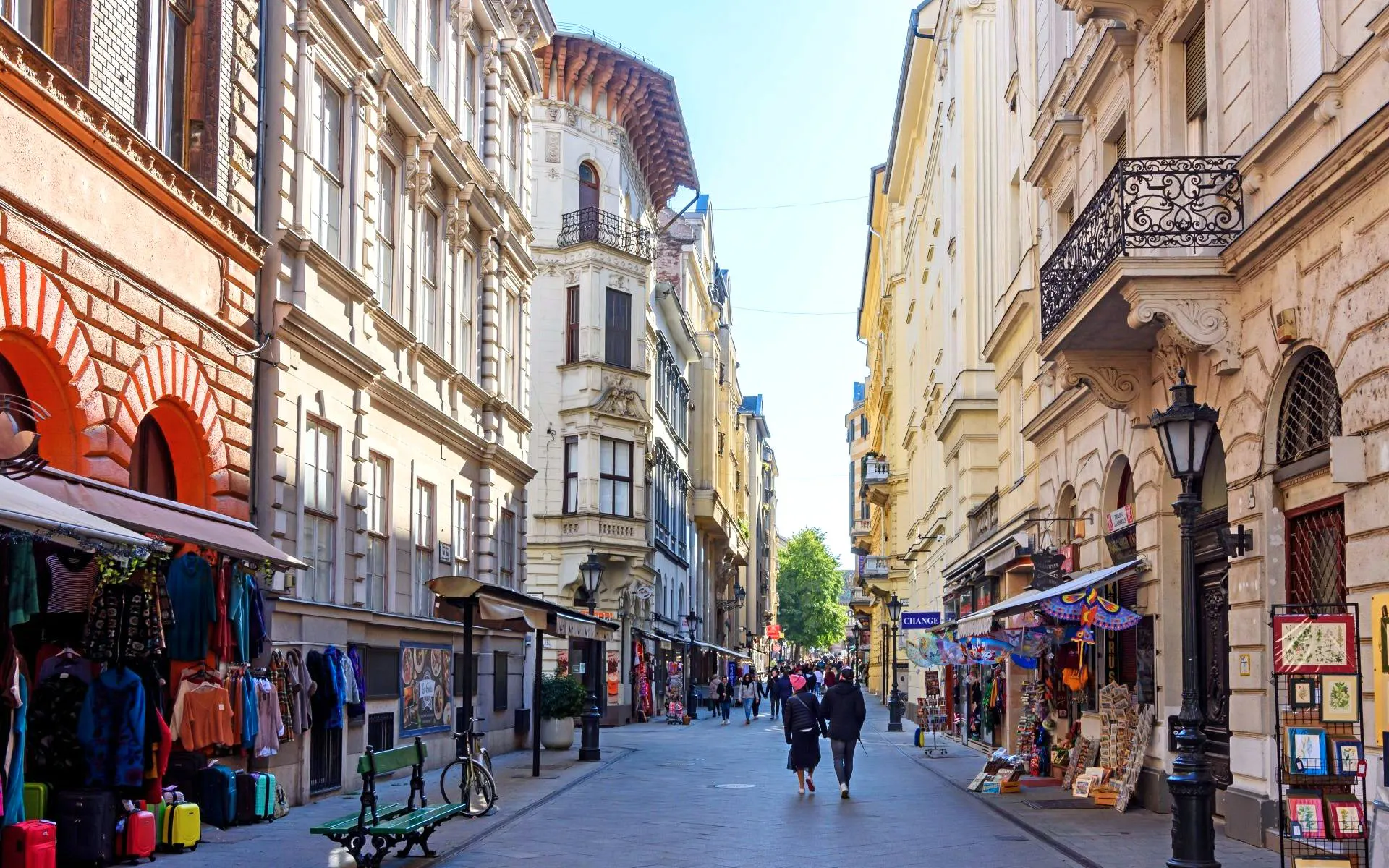Váci utca shopping street in Budapest with people walking and shops lining the street.