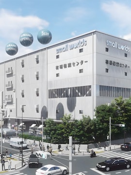 Small Worlds Tokyo building exterior with grand opening balloons.