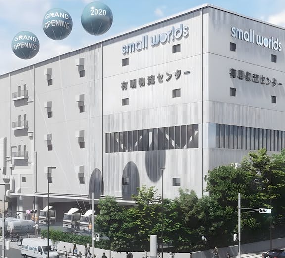 Small Worlds Tokyo building exterior with grand opening balloons.