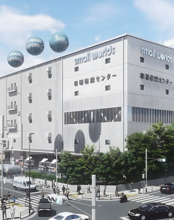 Small Worlds Tokyo building exterior with grand opening balloons.
