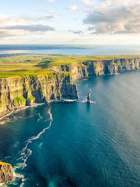 Aerial view of the Cliffs of Moher, Ireland, with rugged cliffs and Atlantic Ocean.