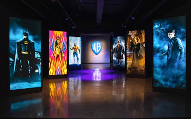 Exhibit at Warner Bros Studio Tour Hollywood with illuminated character portraits.