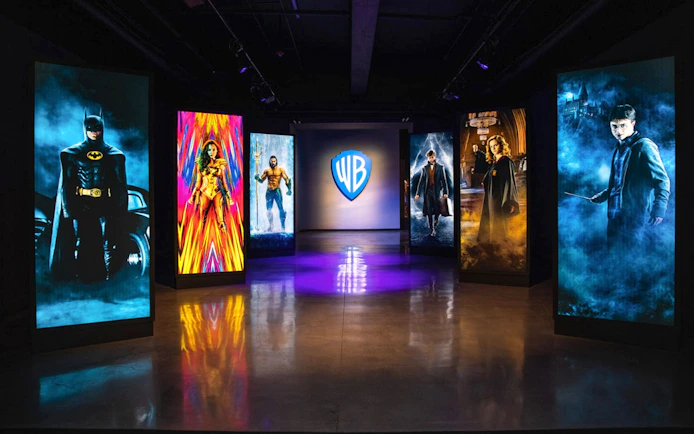 Exhibit at Warner Bros Studio Tour Hollywood with illuminated character portraits.