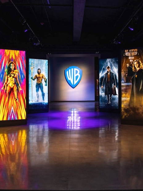 Exhibit at Warner Bros Studio Tour Hollywood with illuminated character portraits.