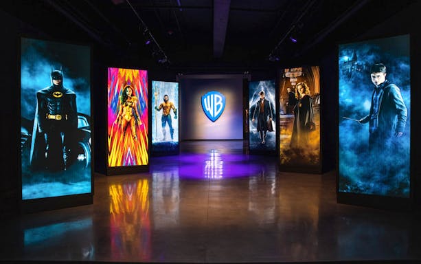 Exhibit at Warner Bros Studio Tour Hollywood with illuminated character portraits.