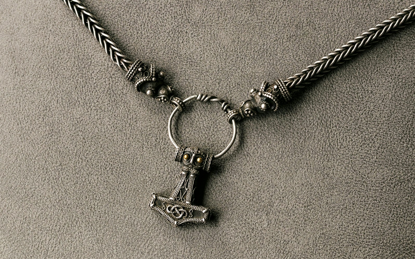 Viking necklace with intricate Thor's hammer pendant.