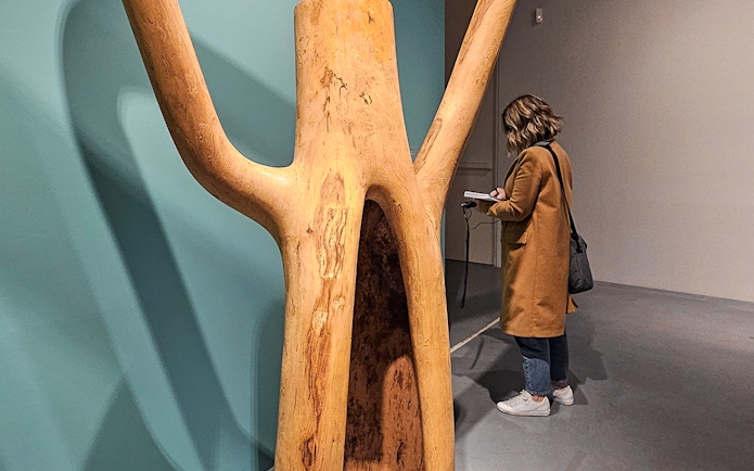 Visitor observing sculpture at Picasso's Birthplace Museum.