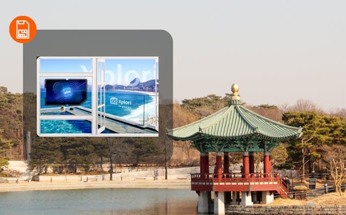 Korean pavilion by a lake with eSIM advertisement overlay.