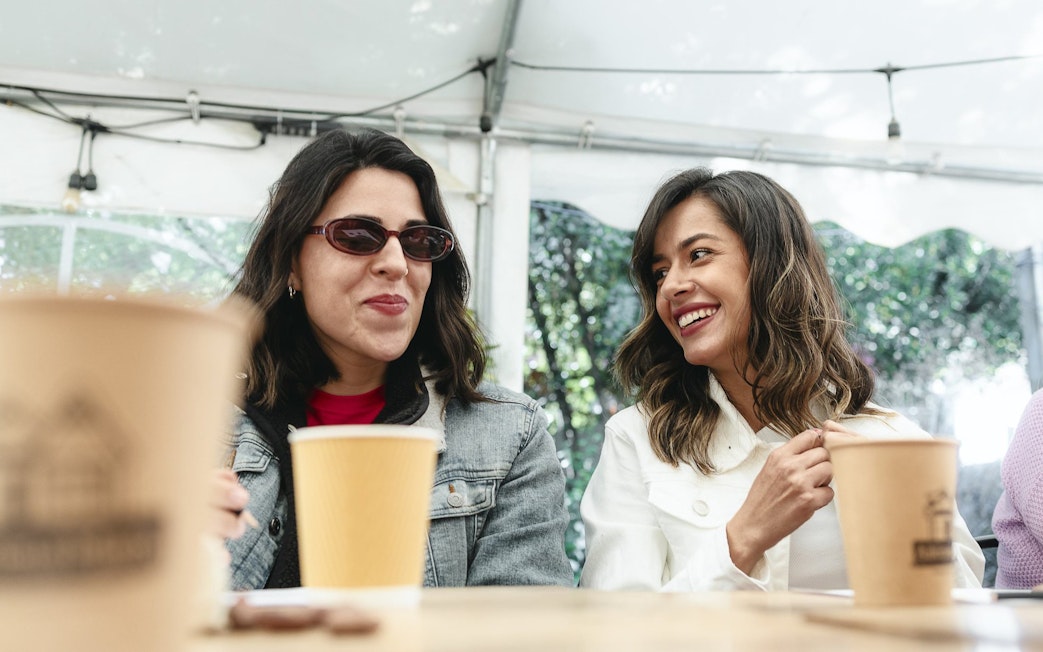 Tourists enjoying drinks and chocolates at El Yeso Reservoir & Santuario del Río Spa.