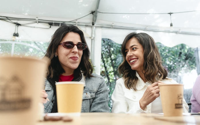 Tourists enjoying drinks and chocolates at El Yeso Reservoir & Santuario del Río Spa.