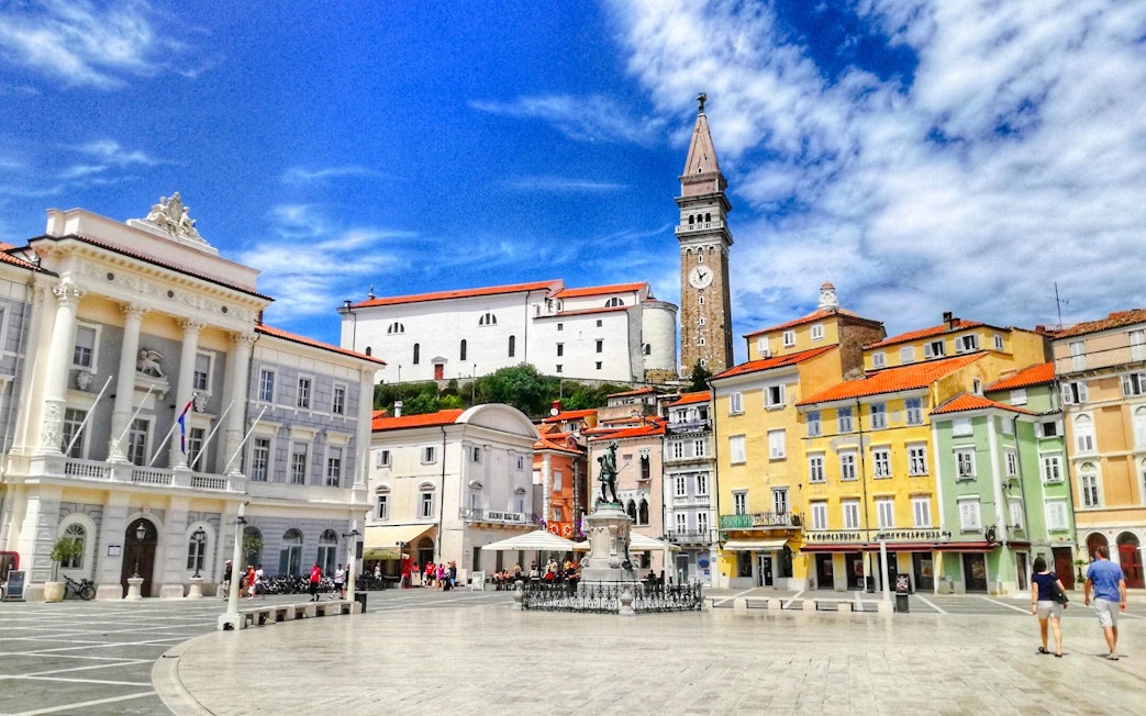Piran Town Square with colorful buildings and bell tower, Slovenia.