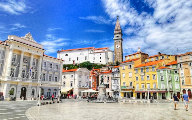 Piran Town Square with colorful buildings and bell tower, Slovenia.