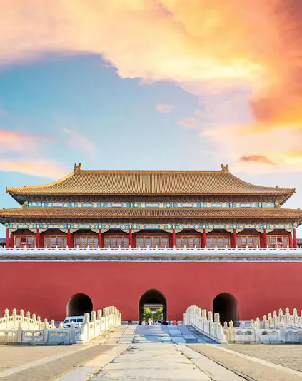Meridian Gate entrance to the Forbidden City, Beijing, under a vibrant sky.