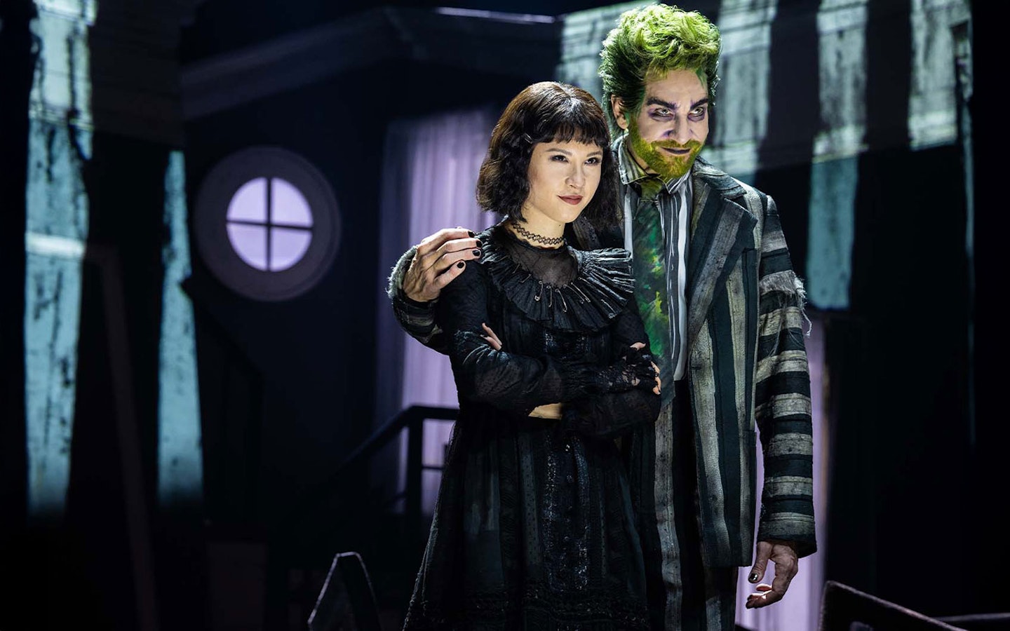 Stage scene from Beetlejuice show in Brisbane featuring two performers.