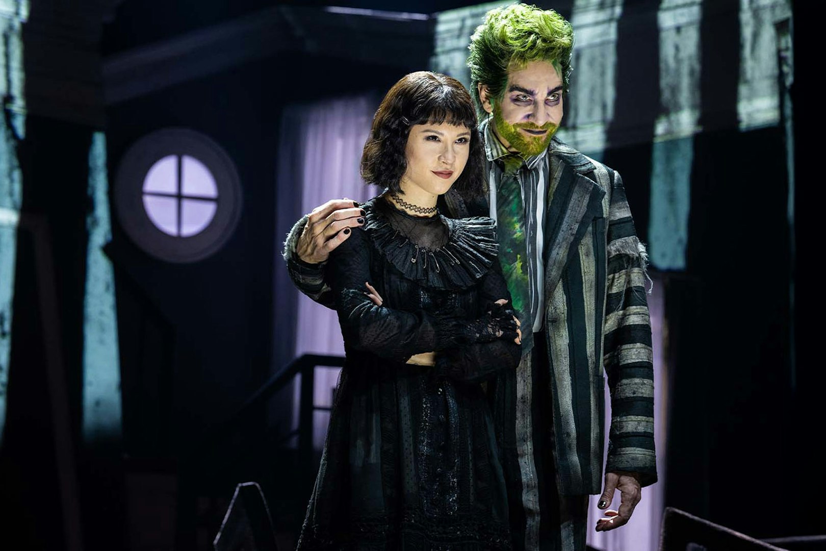 Stage scene from Beetlejuice show in Brisbane featuring two performers.