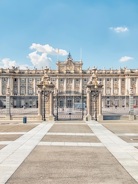 Royal Palace of Madrid exterior with ornate gates and courtyard.