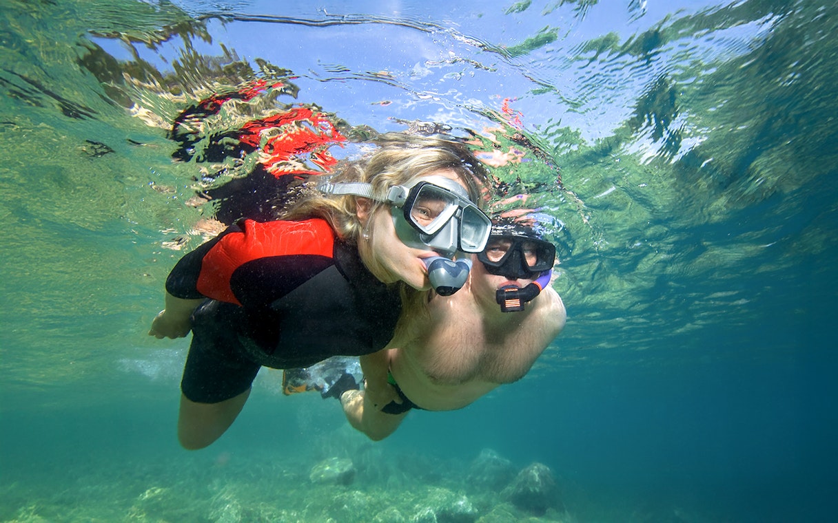 Snorkelers exploring underwater during Elaphiti Islands Cruise tour.