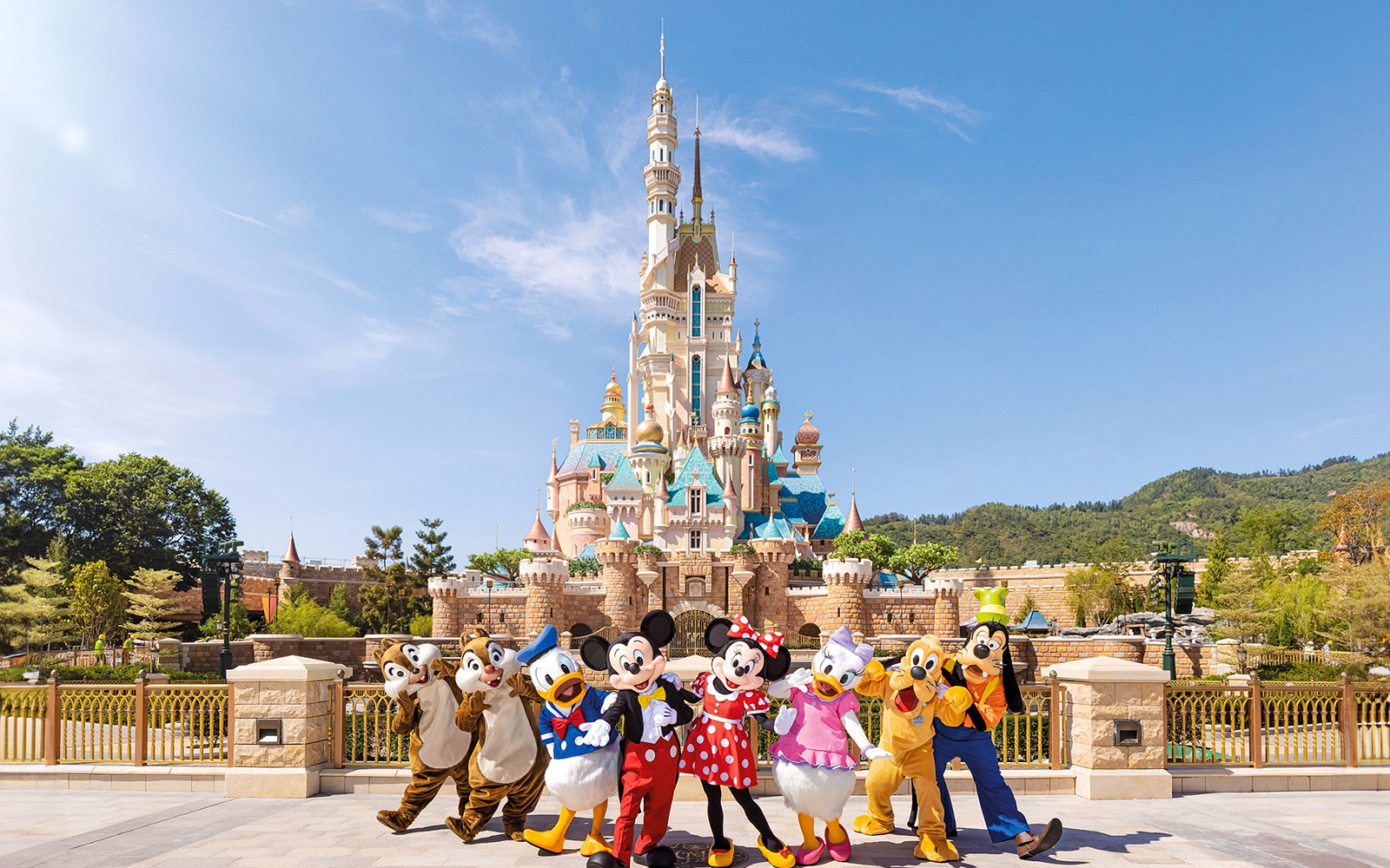 Characters in front of castle at Fantasyland theme park.