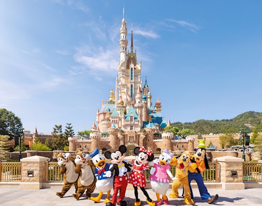 Characters in front of castle at Fantasyland theme park.