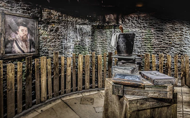 Edinburgh Dungeon Witches Judgement scene with wooden fence and historical props.