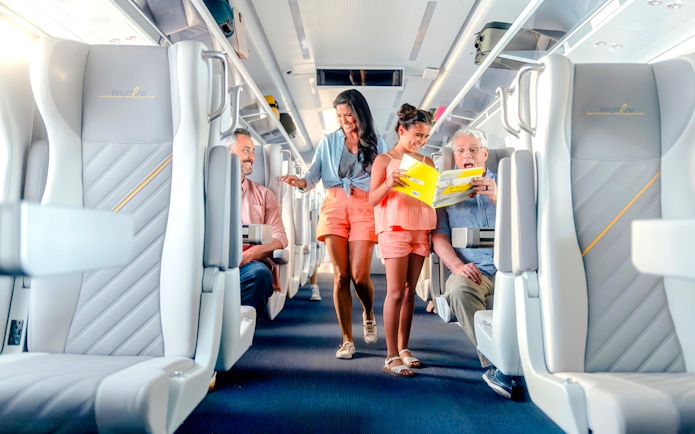 Passengers enjoying a ride on the Brightline train from Miami to Orlando.