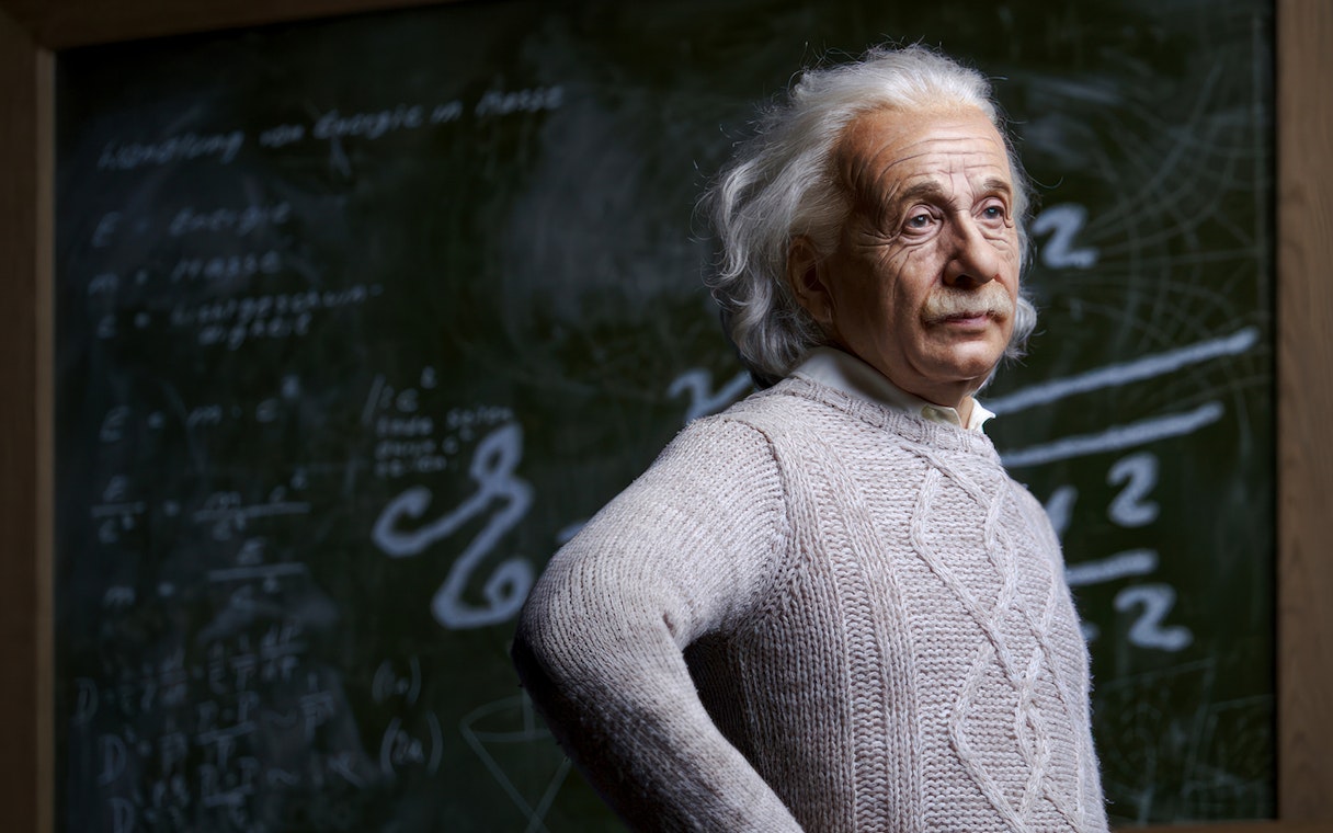 Wax figure of a scientist in front of a chalkboard at Madame Tussauds Tokyo.
