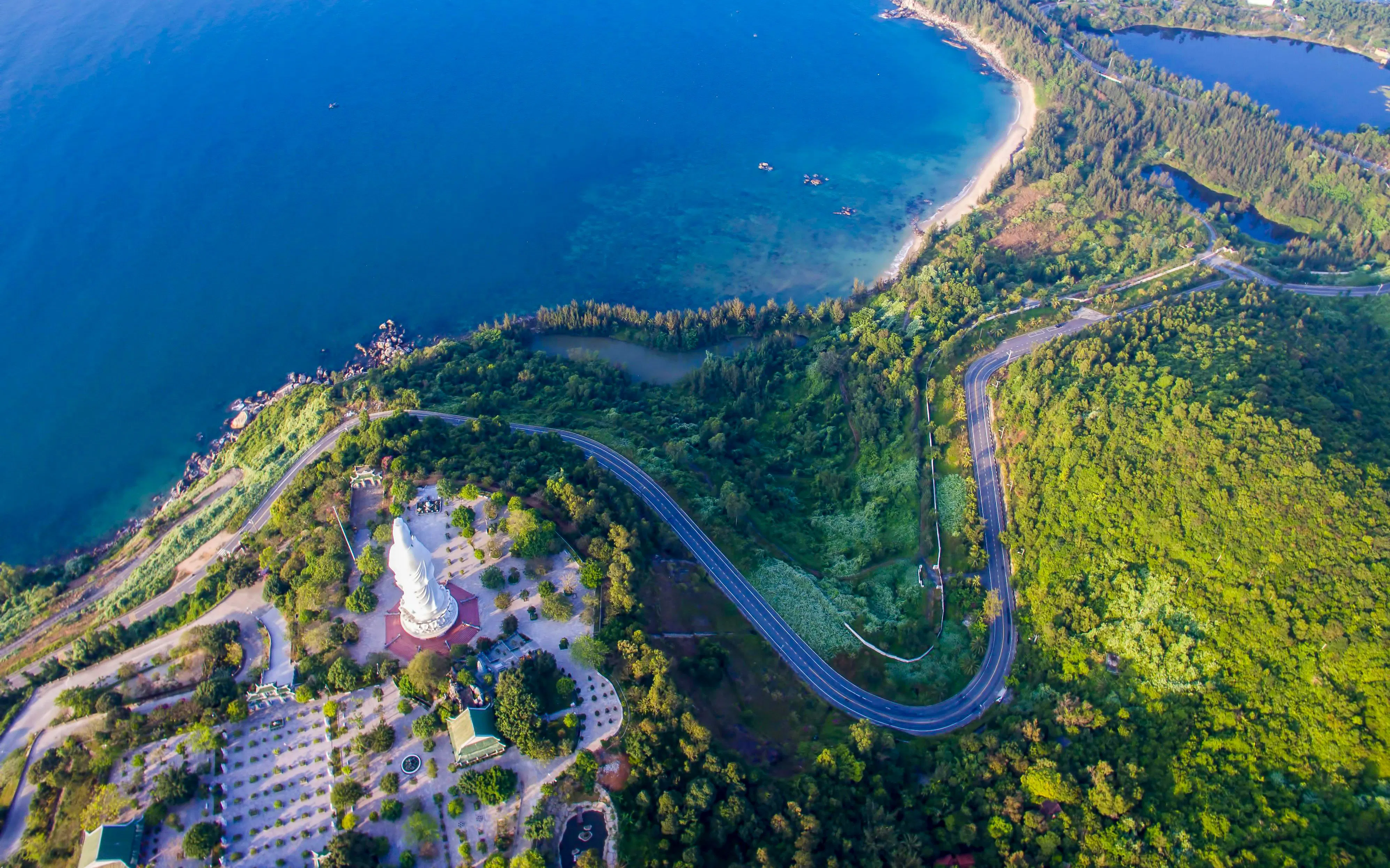 Panoramic view of coastline and lush greenery from Marble Mountains, Da Nang, Vietnam.
