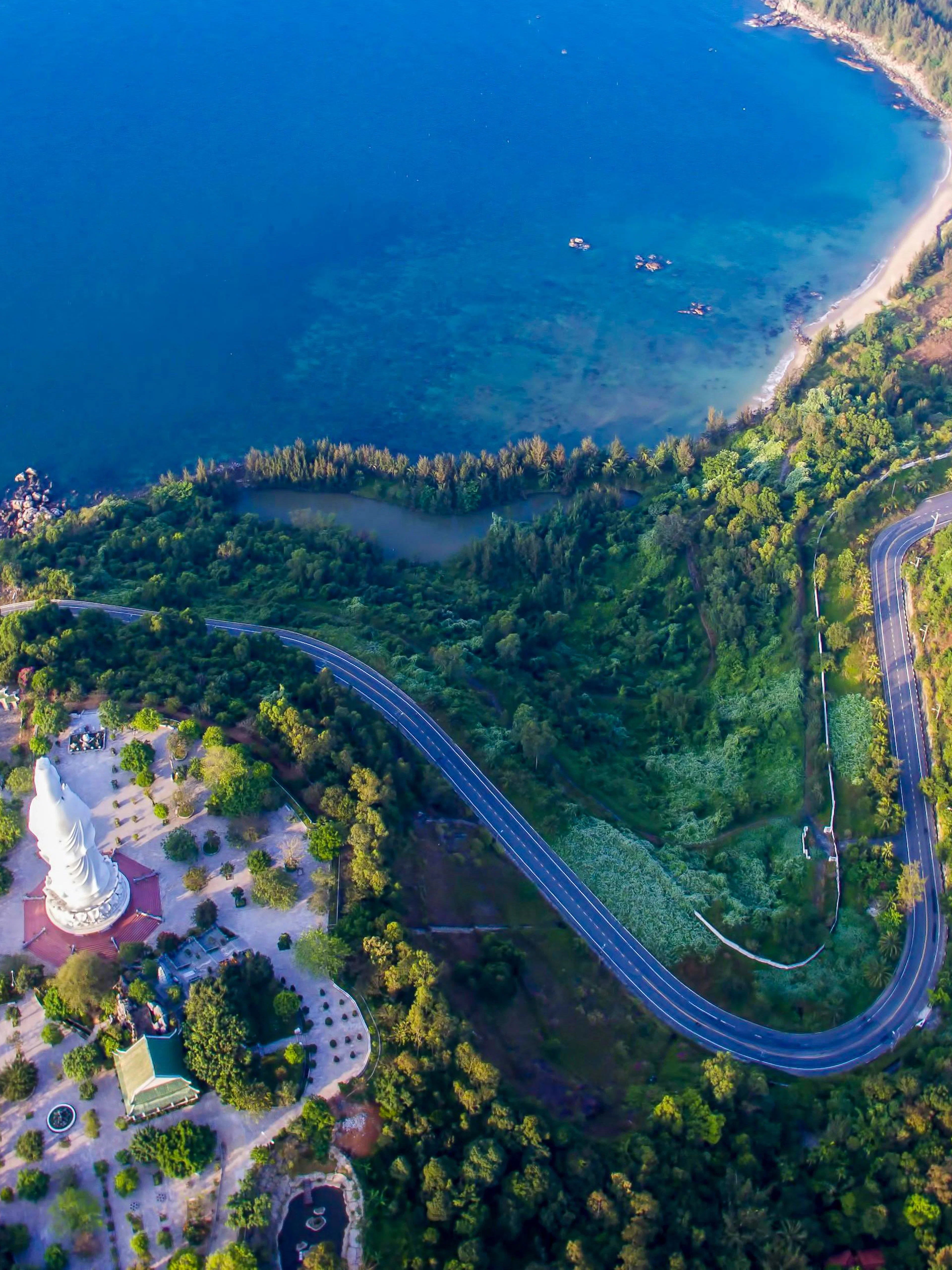 Panoramic view of coastline and lush greenery from Marble Mountains, Da Nang, Vietnam.