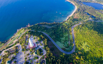 Panoramic view of coastline and lush greenery from Marble Mountains, Da Nang, Vietnam.