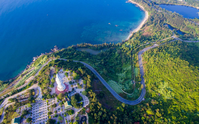 Panoramic view of coastline and lush greenery from Marble Mountains, Da Nang, Vietnam.