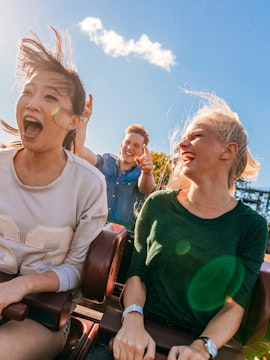 Young friends enjoying a roller coaster ride at Everland, South Korea.