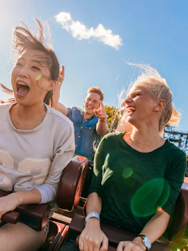 Young friends enjoying a roller coaster ride at Everland, South Korea.