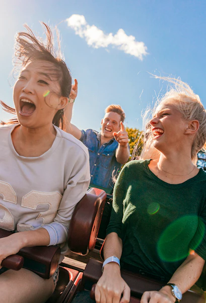 Young friends enjoying a roller coaster ride at Everland, South Korea.