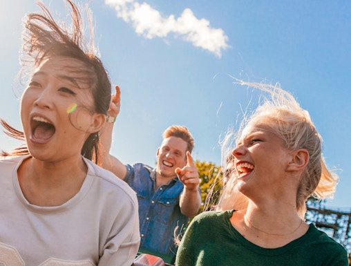 Young friends enjoying a roller coaster ride at Everland, South Korea.