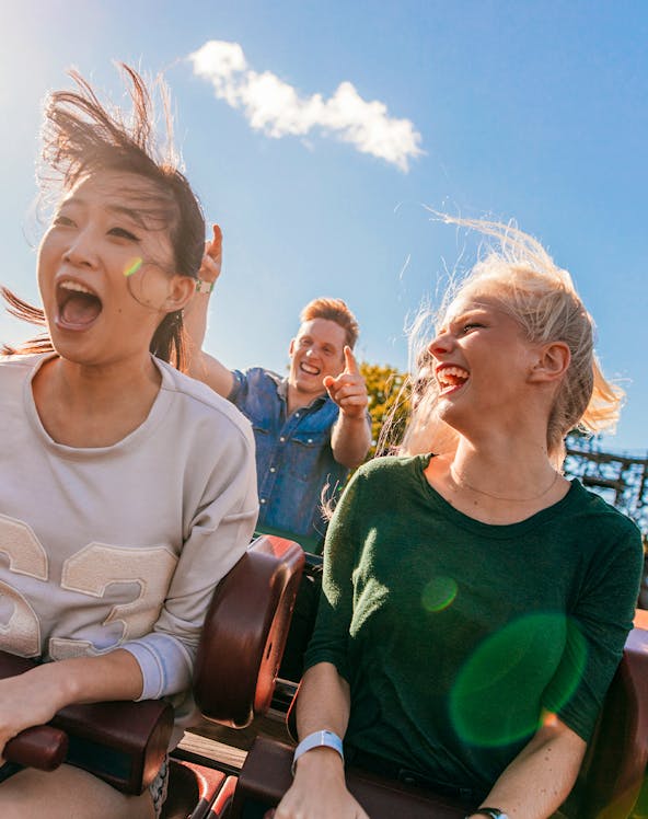 Young friends enjoying a roller coaster ride at Everland, South Korea.