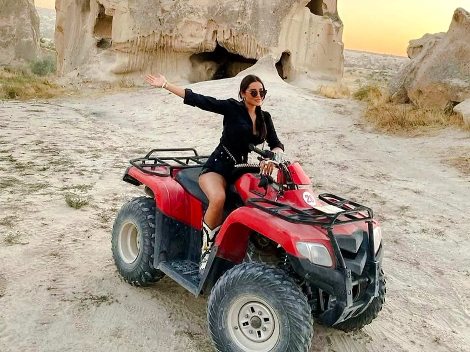 ATV rider exploring rocky landscape during Cappadocia tour.