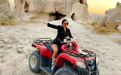 ATV rider exploring rocky landscape during Cappadocia tour.