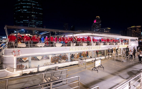 People enjoying a night on the Meridian Cruise in Bangkok.