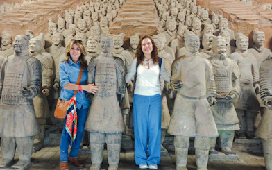 Terracotta Warriors with visitors at Xian Museum, part of Chengdu guided tour.